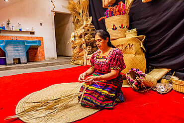 K'iche artisans showing off their beautiful woven straw hats, Guatemala, Central America