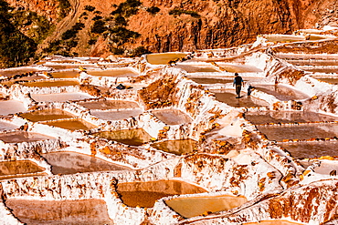 Salt terraces in the Sacred Valley where people are still mining and sifting the terraced pools as the Incas did 1000 years ago, Peru, South America