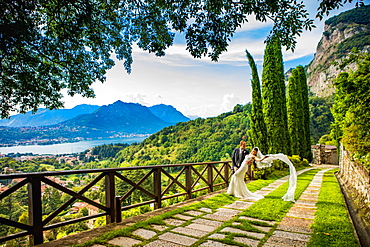 Couple, bride and groom, posing at the Castello di Rossino, Lake Como, Lombardy, Italy, Europe