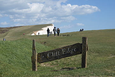 A warning sign near the cliffs at Beachy Head on the south coast, South Downs National Park, East Sussex, England, United Kingdom, Europe