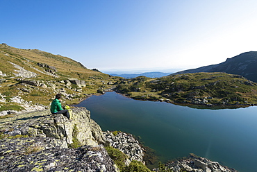 Hiking next to one of the Maliovitsa lakes in the Rila Mountains, Bulgaria, Europe