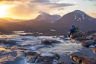 Hiking in the Scottish Highlands in Torridon along The Cape Wrath Trail near Loch Coire Mhic Fhearchair, Highlands, Scotland, United Kingdom, Europe