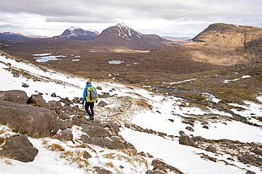 Hiking in the Scottish Highlands in Torridon along The Cape Wrath Trail near Loch Coire Mhic Fhearchair, Highlands, Scotland, United Kingdom, Europe