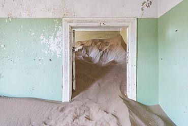 The interior of a building in the abandoned diamond mining ghost town of Kolmanskop, Namibia, Africa