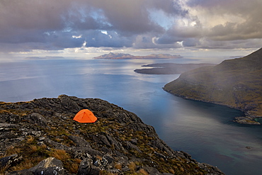 Wild camping on the top of Sgurr Na Stri on the Isle of Skye with views towards the Isle of Soay, Isle of Skye, Inner Hebrides, Scottish Highlands, Scotland, United Kingdom, Europe