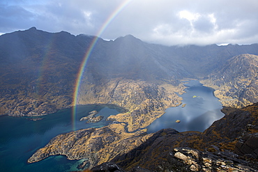 A rainbow above Loch Coruisk and the main Cuillin ridge seen from the top of Sgurr Na Stri on the Isle of Skye, Inner Hebrides, Scotland, United Kingdom, Europe