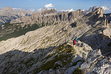 Hiking in typical mountainous terrain of the Dolomites range of the Alps on the Alta Via 1 trekking route near Rifugio Nuvolau, Belluno, Veneto, Italy, Europe