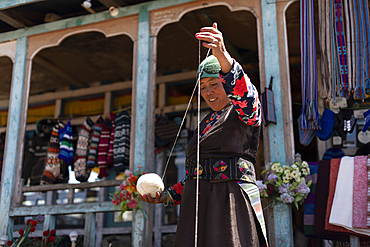 A Sherpa woman from Gosainkund spins baby Yak wool using the traditional method with a spindle, Langtang region, Nepal, Asia