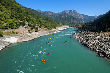 Rafts and kayaks drift down the Karnali River in west Nepal, Asia