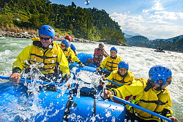 Rafters get splashed as they go through some big rapids on the Trisuli River, Nepal, Asia