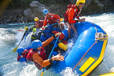 Rafters capsize as they go through some big rapids on the Karnali River, Nepal, Asia