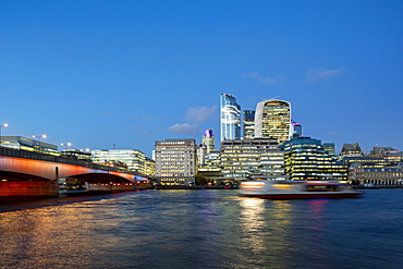 London Bridge across the River Thames lit up with colorful lighting, London, England, United Kingdom, Europe