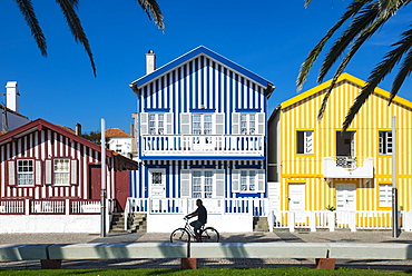 Colourful stripes decorate traditional beach house style on houses in Costa Nova, Portugal, Europe