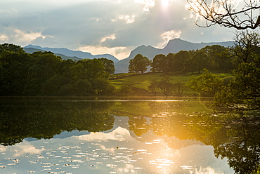 Sunset at Loughrigg Tarn near Ambleside in The Lake District National Park, Cumbria, England, United Kingdom, Europe