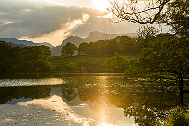 Sunset at Loughrigg Tarn near Ambleside, Lake District National Park, Cumbria, England, United Kingdom, Europe