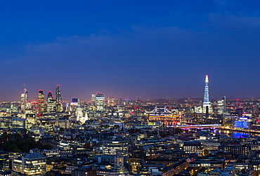 A night-time view of London and the River Thames from the top of Centre Point tower across to The Shard, St. Paul's Cathedral and City skyline, London, England, United Kingdom, Europe