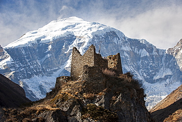 A ruined ancient Dzong at Jangothang with the face of Jomolhari mountain visible behind, Thimpu district, Bhutan, Himalayas, Asia