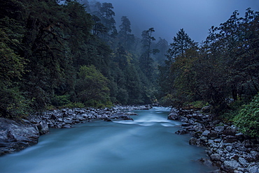 Langtang Khola near the little village of Riverside on a misty evening in the Langtang region of Nepal, Himalayas, Asia