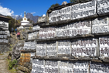 Mani stones inscribed with an ancient Buddhist mantra decorate the trail to Everest Base Camp, Khumbu Region, Nepal, Himalayas, Asia