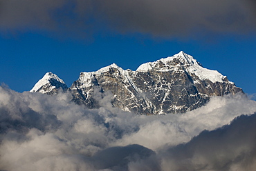 A view of Taboche through the clouds seen from Kongde in the Everest region, Nepal, Himalayas, Asia