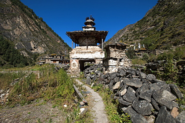 Mani stones and a Kani are the gateway to a small village in the Kagmara valley in Dolpa, a remote region of Nepal, Himalayas, Asia