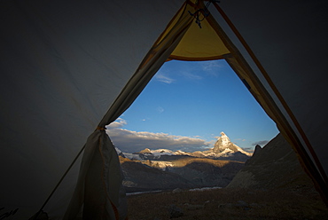 A view of the Matterhorn in the Swiss Alps from a tent while camped beside the Gorner glacier, Zermatt, Valais, Switzerland, Europe