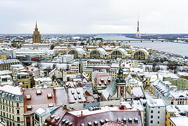 View over Riga Old Town city centre and Daugava River, with snow covered rooftops, UNESCO World Heritage Site, Riga, Latvia, Europe