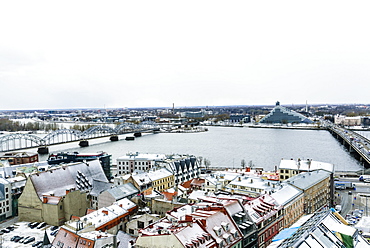 View over Riga Old Town city centre and Daugava River, with snow covered rooftops, UNESCO World Heritage Site, Riga, Latvia, Europe