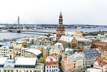 View over Riga Old Town city centre and Daugava River, with snow covered rooftops, UNESCO World Heritage Site, Riga, Latvia, Europe