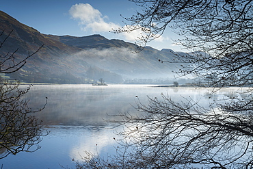 Dawn light and transient sunlit mist over Wall Holm Island on Ullswater, Lake District National Park, UNESCO World Heritage Site, Cumbria, England, United Kingdom, Europe