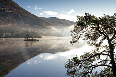 Dawn light and transient sunlit mist over Wall Holm Island on Ullswater, Lake District National Park, UNESCO World Heritage Site, Cumbria, England, United Kingdom, Europe