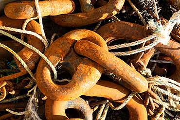 Large rusting fishing boat chain links on the harbour side at Gairloch, Wester Ross, North West Highlands, Scotland, United Kingdom, Europe