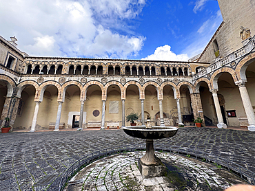 Courtyard fountain with arches and pillars of Salerno Cathedral. Italy. Europe.