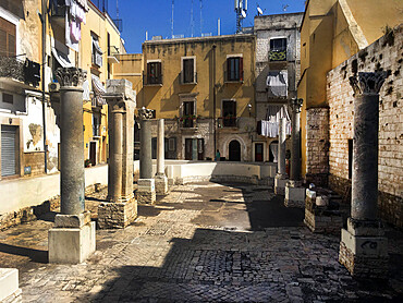 Roman ruins in the centre of Bari old town surrounded by residential homes, Bari, Apulia, Italy, Europe