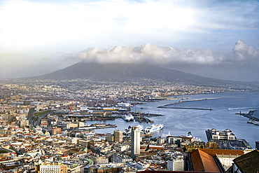 A view of the Bay of Naples with the cruise liner port in the foreground and Mount Vesuvius in the background. Italy.