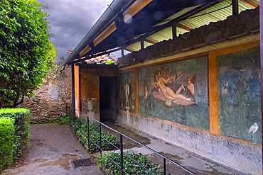 A courtyard fresco in the Roman ruins of Pompeii. Italy.