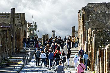 Tourists in the archeological ruins of Pompeii. Italy, Europe.