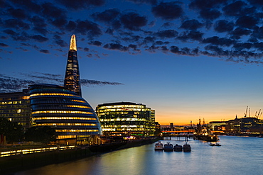 Dusk settles over London after sunset along the River Thames, with the Shard, London, England, United Kingdom, Europe