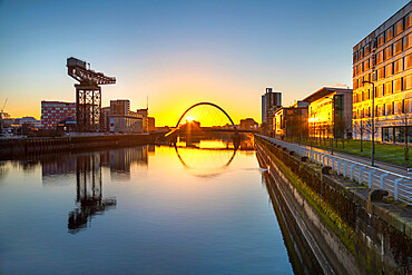 Sunrise over River Clyde, Finnieston Crane, Clyde Arc (Squinty Bridge), River Clyde, Glasgow, Scotland, United Kingdom, Europe