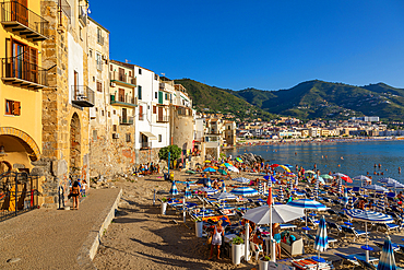 Tourists on beach, Cefalu, mountains in background, Province of Palermo, Sicily, Italy, Mediterranean, Europe