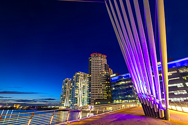 Media City footbridge at dusk, Media City UK, Salford Quays, Greater Manchester, England, United Kingdom, Europe