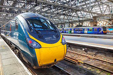 Avanti West Coast Pendolino train and class 320 train in background, Central Station, Glasgow, Scotland, United Kingdom, Europe