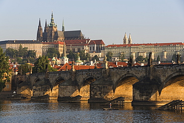 Prague Castle, Hradcany, Mala Strana, and Charles Bridge lit by sunrise, UNESCO World Heritage Site, Prague, Czech Republic, Europe