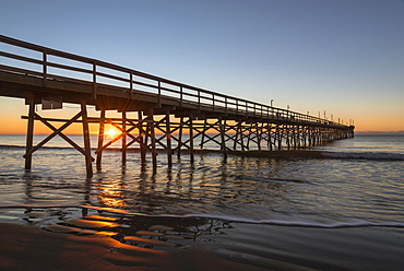 Pier at sunset on Sunset Beach in North Carolina, USA, North America