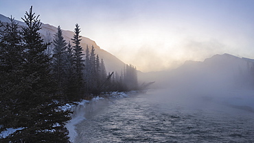 Mist rising off the waters of the Bow River in sub-zero winter weather, Canmore, Alberta, Canadian Rockies, Canada, North America