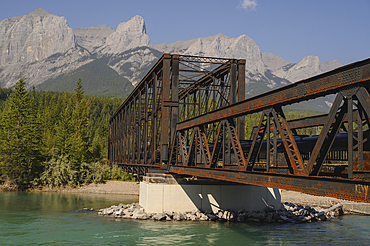 Bow River Iron Bridge and Mount Lawrence Grassi on a hazy summer evening caused by wildlife smoke, Canmore, Alberta, Canadian Rockies