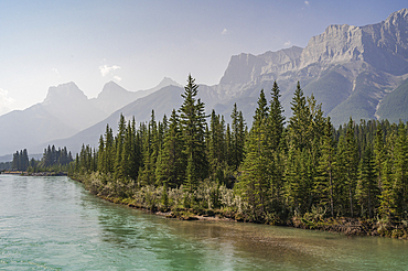 Bow River and Mount Lawrence Grassi on a hazy summer evening caused by wildlife smoke, Canmore, Alberta, Canadian Rockies