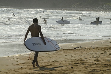 Surfing and swimming at Lawrencetown Provincial Park, Nova Scotia, Canada