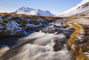 Glacial river and snow-capped mountains, Snaefellsnes, Iceland, Polar Regions