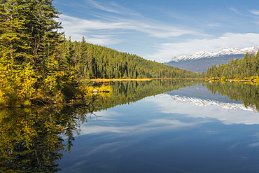 Mountains reflected in a lake along Valley of Five Lakes trail, Jasper National Park, UNESCO World Heritage Site, Alberta, Canada, North America